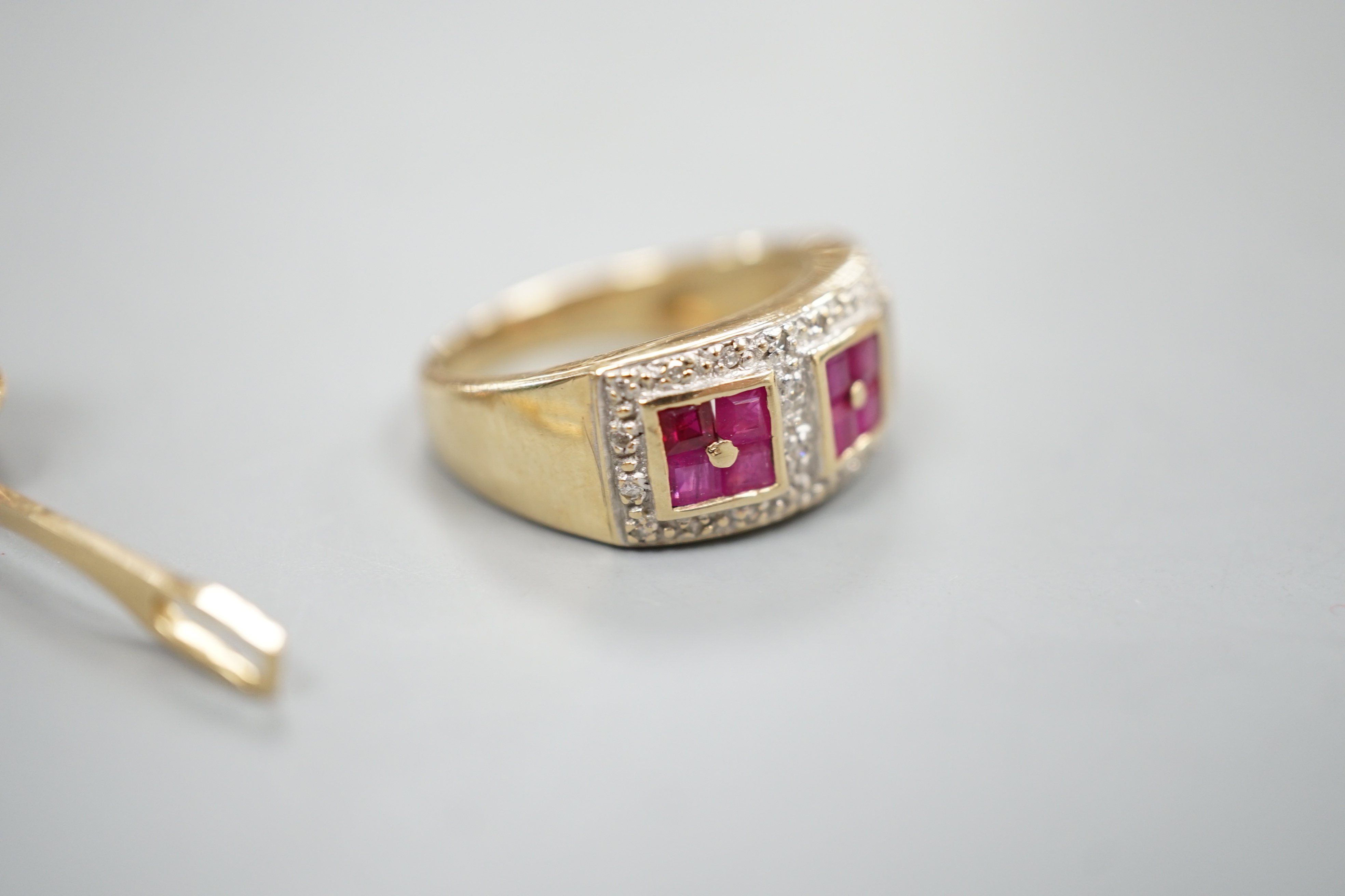 A modern 9ct gold, ruby and diamond cluster ring and a modern yellow metal and gem set pendant, gross 7.8 grams.